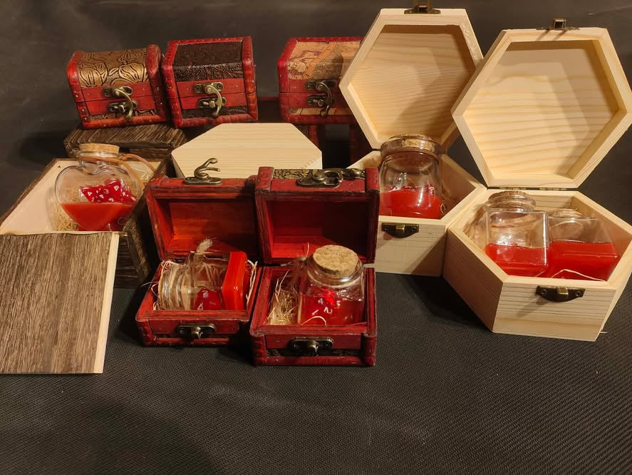 Set of small wooden treasure chests with glass jars containing heling potions